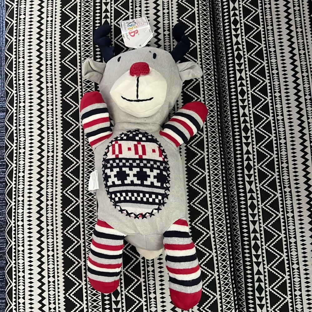 NYGB reindeer approx 18” ( full measurement around 22”) x 7” cozy knit toy